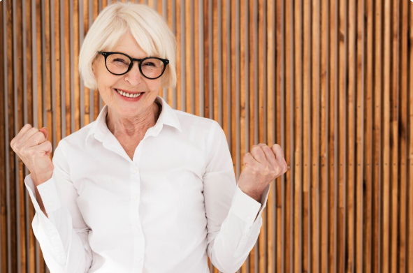 A Lady wearing trendy eyeglasses and posing in front of the camera