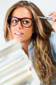 A girl wearing oval shaped female eye frames